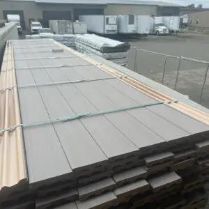 Stacks of siding panels at industrial facility.