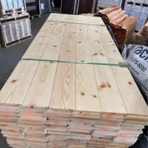 Stack of wooden planks in warehouse.